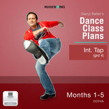 Cover art for Darryl Retter’s Dance Class Plans: Intermediate Tap (Grade 4), Months 1–5 by MusicWorks. Features Darryl Retter in a red sweater performing a tap pose against a warm red gradient background with white title text and a silver “Video” download icon.